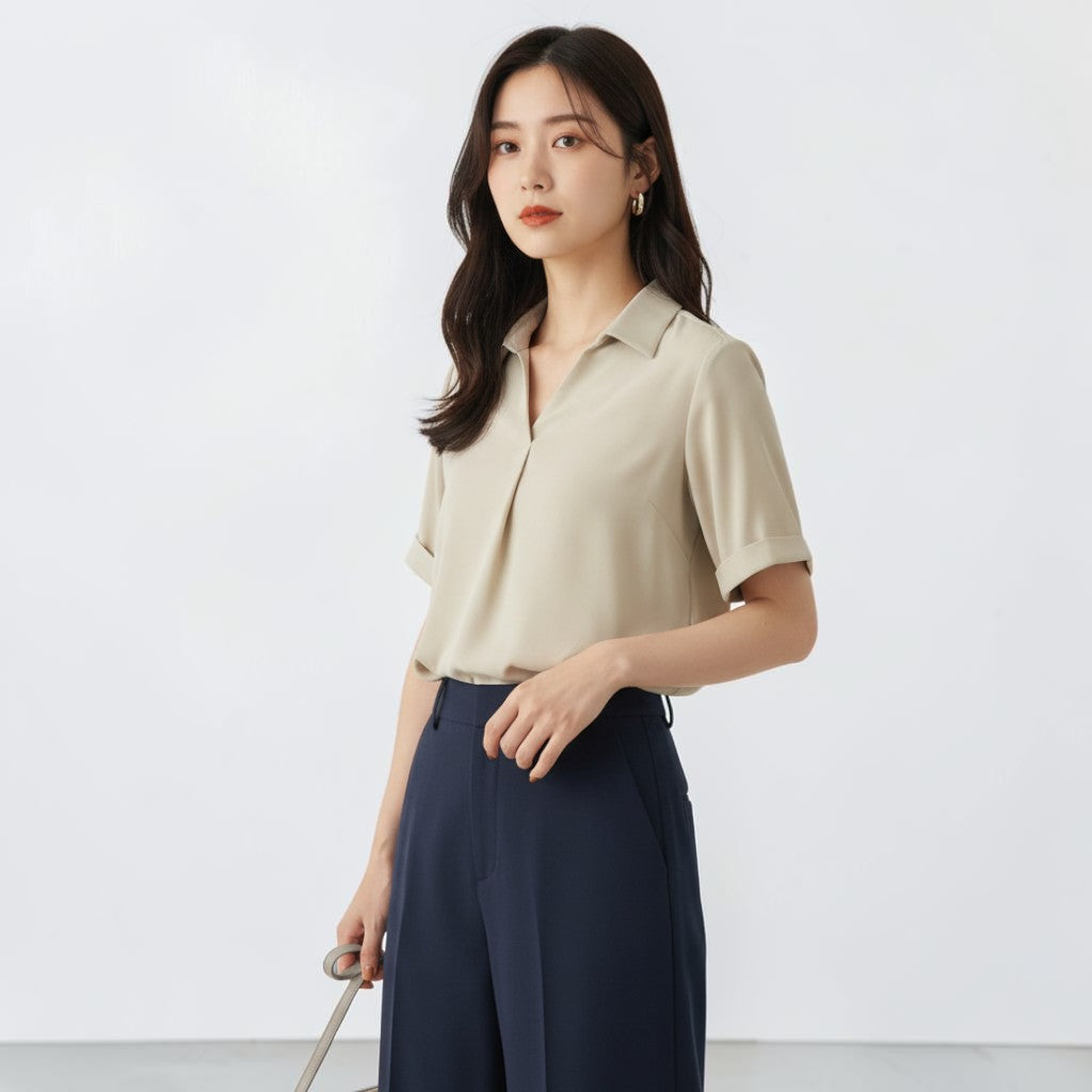 OnenessU short-sleeve beige blouse in recycled polyester with a minimalist collar and soft drape on a model