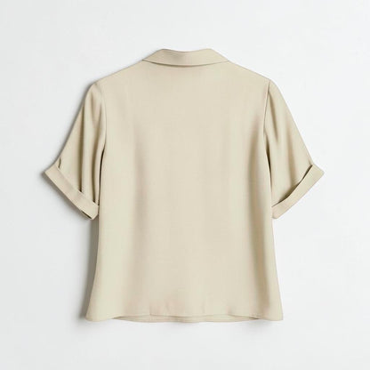 Back view of OnenessU short-sleeve basic blouse in a soft yellow-base neutral tone with a minimalist collar.